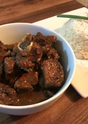A picture of Caribbean curry goat and Rice.