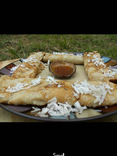A picture of Pancake with grated coconut.