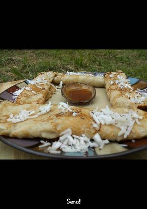 A picture of Pancake with grated coconut.
