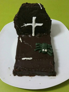 Una foto de Tumba de bizcocho de calabaza bañada en chocolate