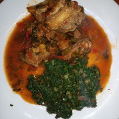 A picture of Beef Stew with spinach.