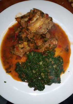 A picture of Beef Stew with spinach.