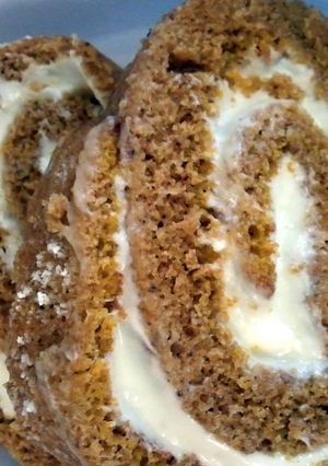A picture of pumpkin roll with cream cheese filling.
