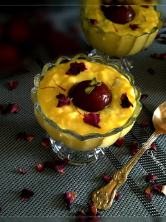 A picture of Gulab Jamun with kesar Rabri.