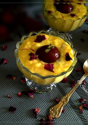 A picture of Gulab Jamun with kesar Rabri.