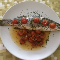 Sea Bass with cherry tomatoes al cartoccio A picture of Sea Bass with cherry tomatoes al cartoccio.