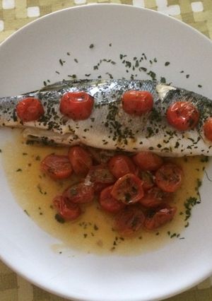 A picture of Sea Bass with cherry tomatoes al cartoccio.