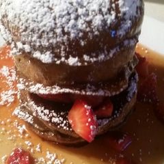 A picture of Chocolate Pannetone French Toast w/ Mascerated Strawberries.
