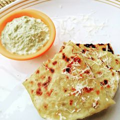 A picture of Cheesy banana chickpeas Paratha with peanut chutney.