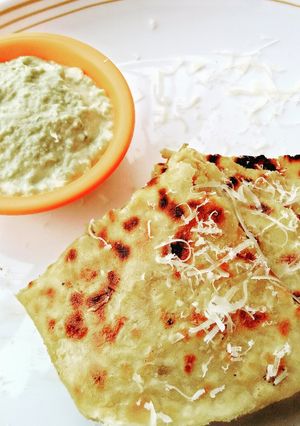 A picture of Cheesy banana chickpeas Paratha with peanut chutney.