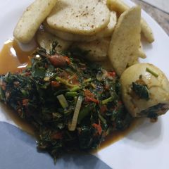 A picture of Fried yam and vegetable sauce.