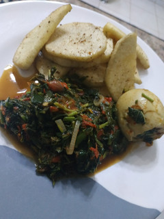 A picture of Fried yam and vegetable sauce.