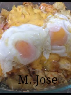 Una foto de Patatas con queso fundido