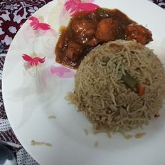 A picture of Chilli chicken and veg fried rice.
