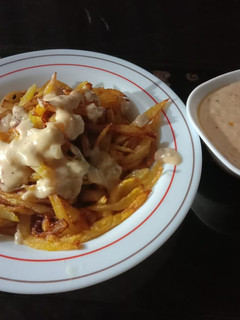 A picture of French Fries with white Sauce 🍟.