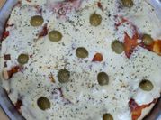 Una foto de pizza casera chica