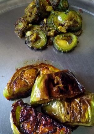 A picture of Brinjal fry and bitter gourd sliced brinjal fry.
