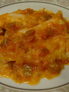 A picture of Hake in Tomato and Green Pepper Sauce.