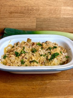 A picture of Leeks in vegan cheese sauce 🌱.