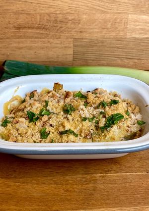 A picture of Leeks in vegan cheese sauce 🌱.