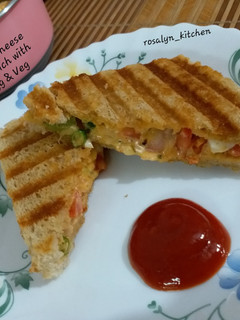 A picture of Grilled Cheese Sandwich with Egg & Vegetables.