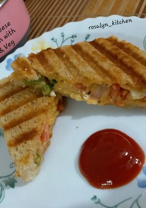 A picture of Grilled Cheese Sandwich with Egg & Vegetables.