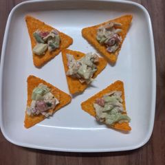 A picture of Nacho salad with Ranch Dressing.