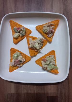 A picture of Nacho salad with Ranch Dressing.