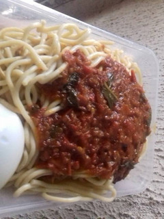 A picture of Spagetti with boiled egg and tomatoes stew.