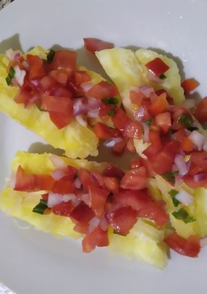 A picture of Boiled Yuca with Chimichurri.