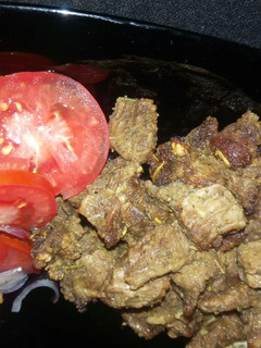 A picture of Grilled beef,Kenyan greens & white rice.