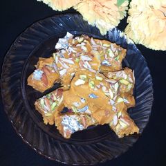 Mohanthal gujrati besan ki mithai Bye 2021 welcome 2022 A picture of Mohanthal gujrati besan ki mithai Bye 2021 welcome 2022.