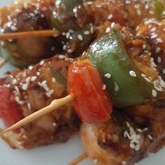 A picture of Chicken satay with spicy garlic sauce.
