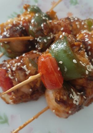 A picture of Chicken satay with spicy garlic sauce.