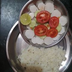 A picture of Jeera rice with salad.