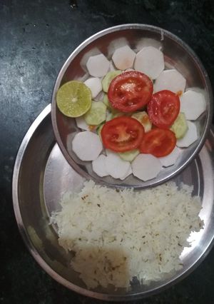 A picture of Jeera rice with salad.