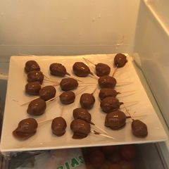 A picture of Fruits in chocolate.