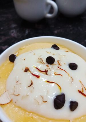 A picture of Kesar badam mug cakes with shrikhand frosting.