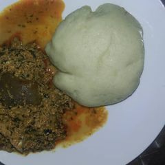 A picture of Egusi and bitterleaf soup.
