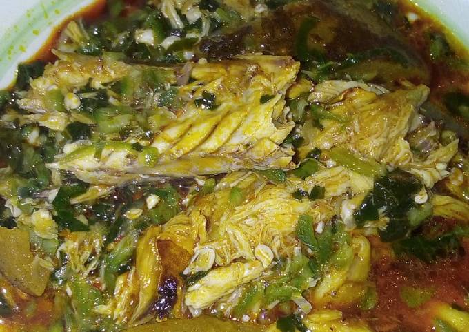 Okra soup garnished with fish and pomo