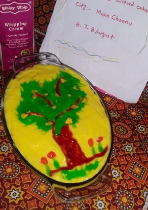 A picture of Mango custard cake with green mango tree.