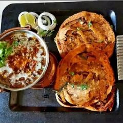 Dal Bukhara With Garlic Lachcha Paratha A picture of Dal Bukhara With Garlic Lachcha Paratha.