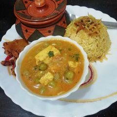 Matar Paneer with caramelized onion rice A picture of Matar Paneer with caramelized onion rice.