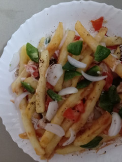 A picture of French fries salad.