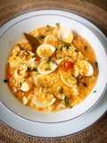 Arroz caldoso con almejas y merluza