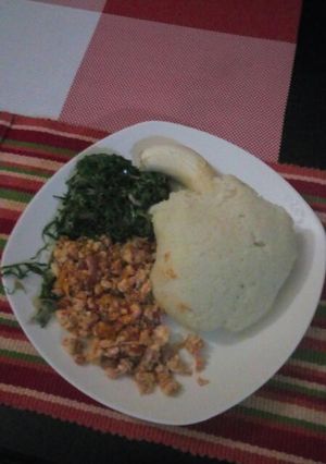 A picture of Eggs,Ugali with Fried kales.