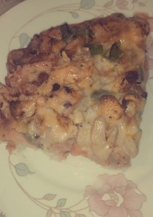A picture of Chicken tikka pizza.