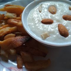 A picture of Samak ki kheer with fried aaloo.