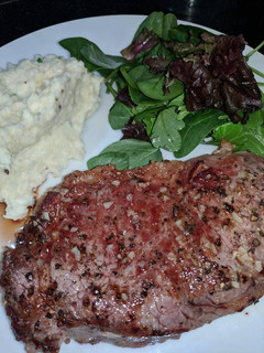 A picture of Pan Fried Porterhouse Steak w/ Garlic Butter and Rosemary.