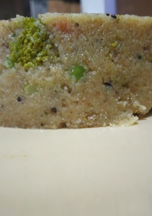 A picture of Upma with lots of veggies.
